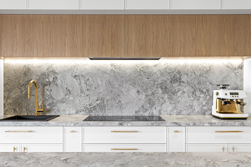 Elevate your home with Dura Group's bespoke kitchen renovations, featuring elegant marble countertops, a chic backsplash, and modern fixtures. Our Sydney-based, family-owned building company specializes in transforming kitchens, providing customized and high-quality solutions that cater to your unique style and needs. With over 27 years of experience, Managing Director Mark ensures projects are completed on time and within budget in regions such as Sutherland Shire, Bayside, and Randwick. Choose Dura Group for your kitchen upgrade to experience exceptional craftsmanship, transparency, and a homeowner-first approach. Contact us to start designing your dream kitchen today!
